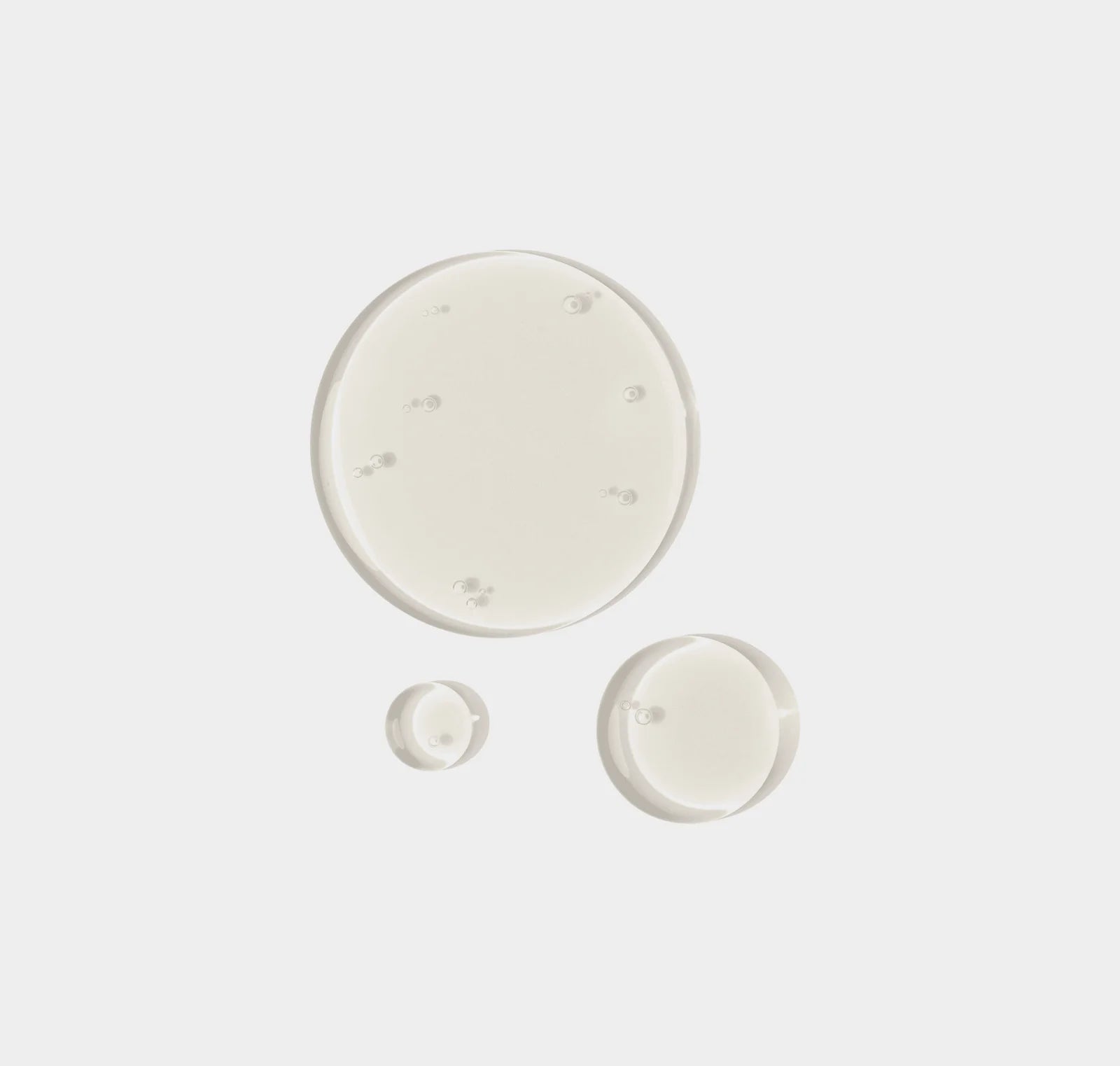 Three circular ceramic plates of different sizes on a white background