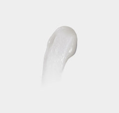 White gel-like substance on a light gray background