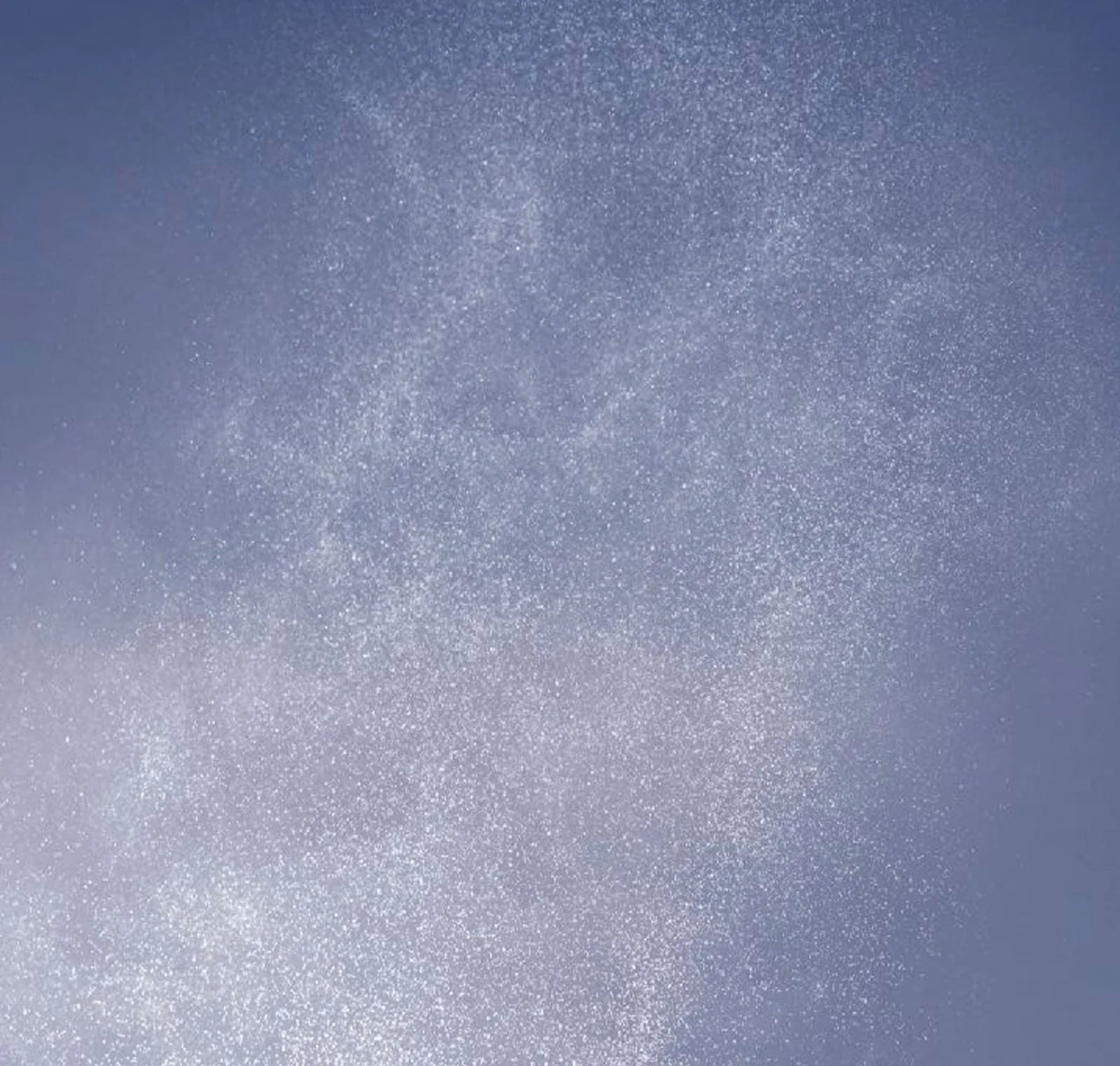 Textured blue and gray background with a star-like pattern
