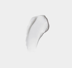 White cream swatch on a light gray background