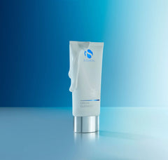 Tube of cream cleanser on a blue gradient background