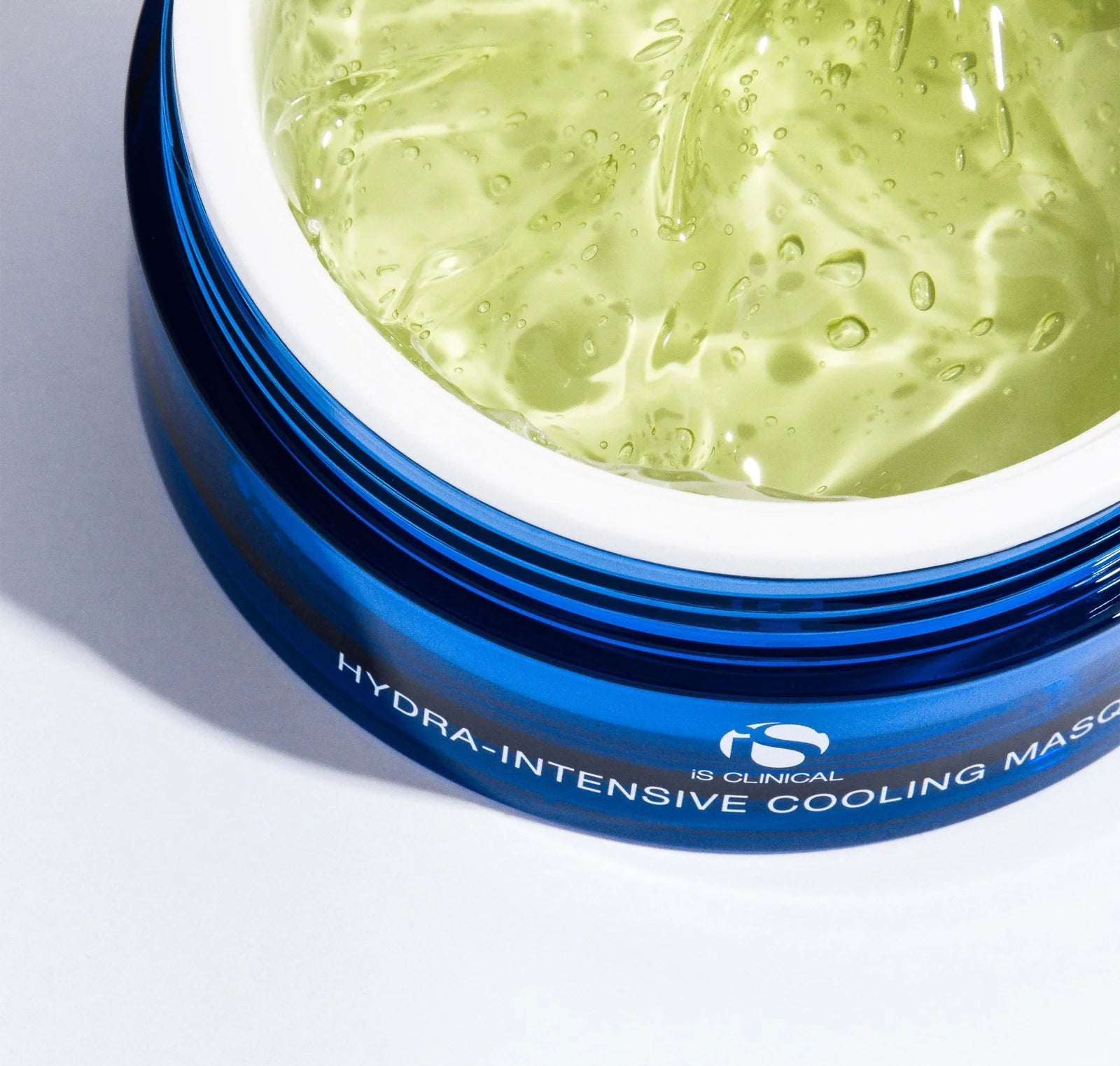 Hydra-intensive cooling mask in a blue container on a light gray background