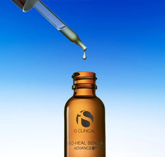 Brown serum bottle with dropper on a blue gradient background