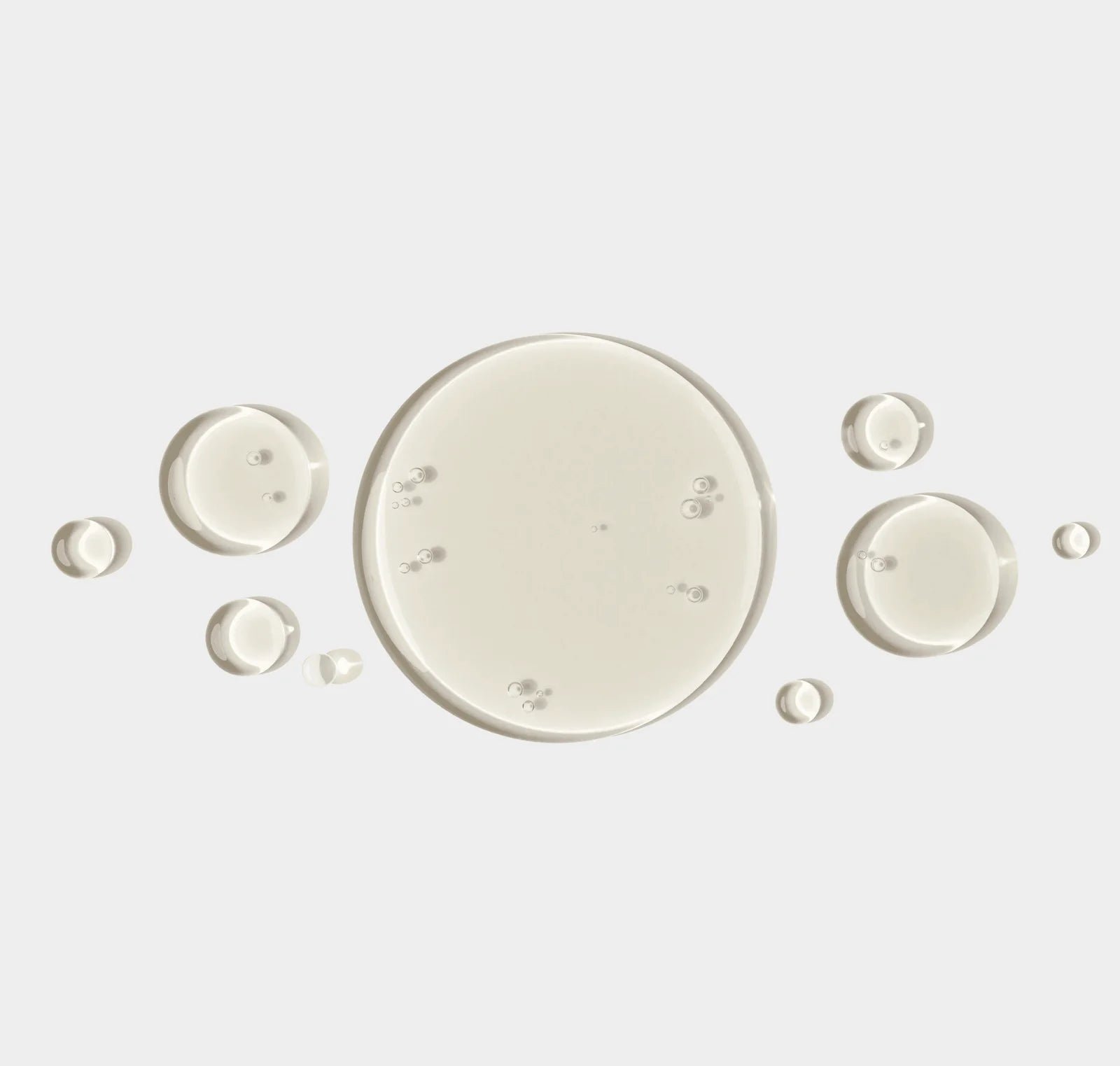 White circular droplets on a light gray background