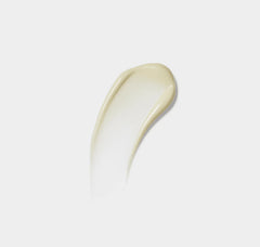 White cream smear on a light gray background