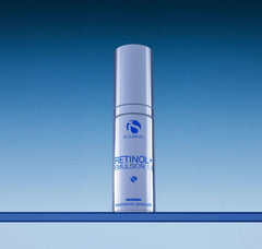Skincare bottle labeled 'Retinol Emulsion' on a blue gradient background