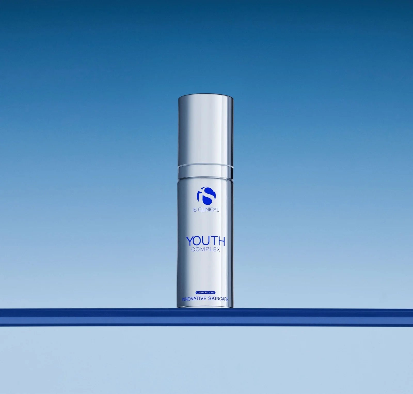 Skincare bottle labeled 'Youth Complex' on a blue gradient background