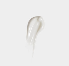 White ceramic spoon on a light gray background