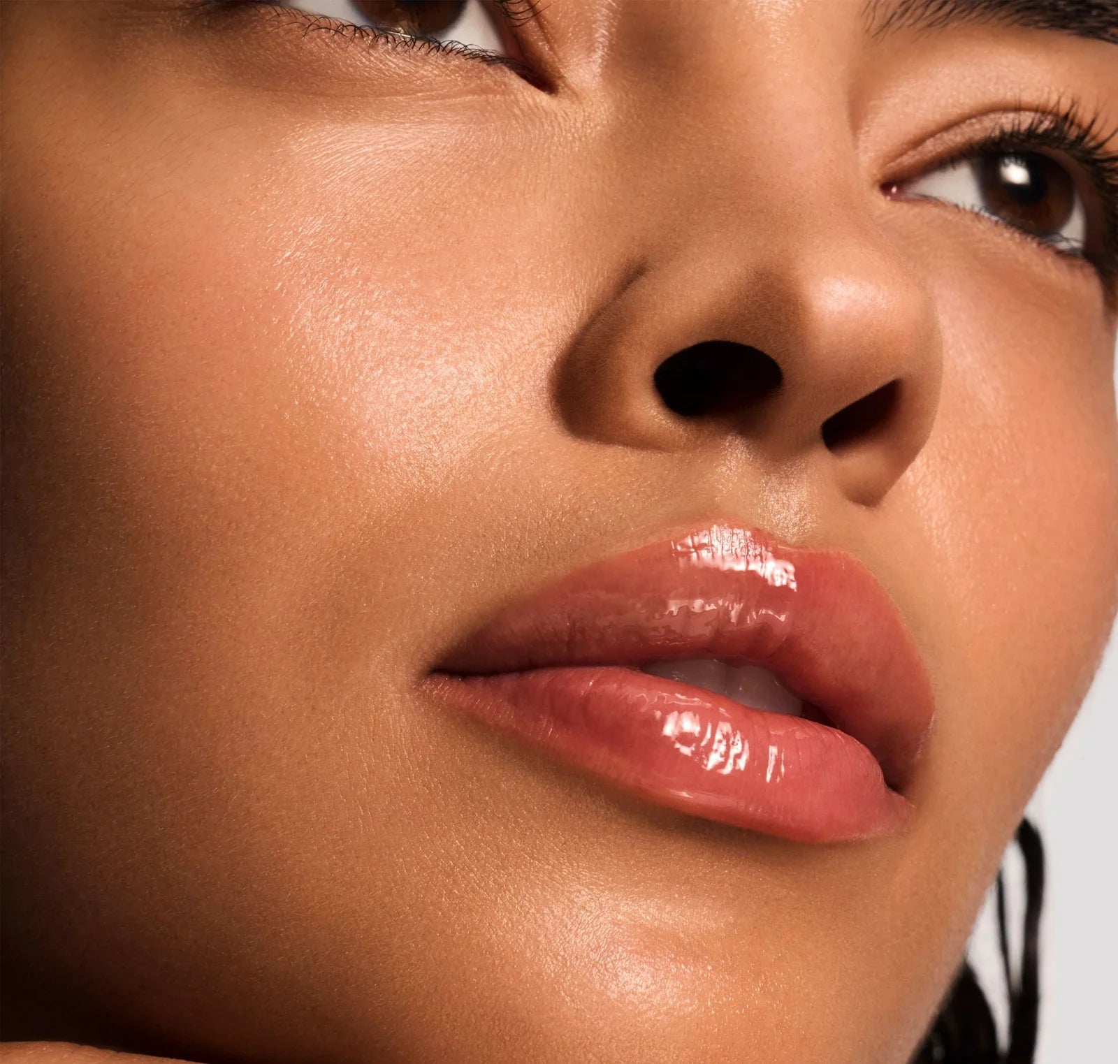 Close-up of a woman's lips with a glossy lip color