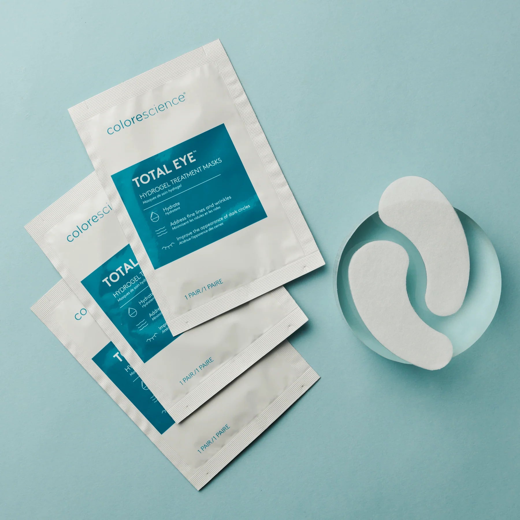 Colorescience Total Eye hydrogel treatment masks on a light blue background