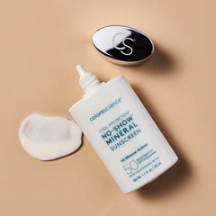 Colorescience no-show mineral sunscreen bottle with applicator on a beige background