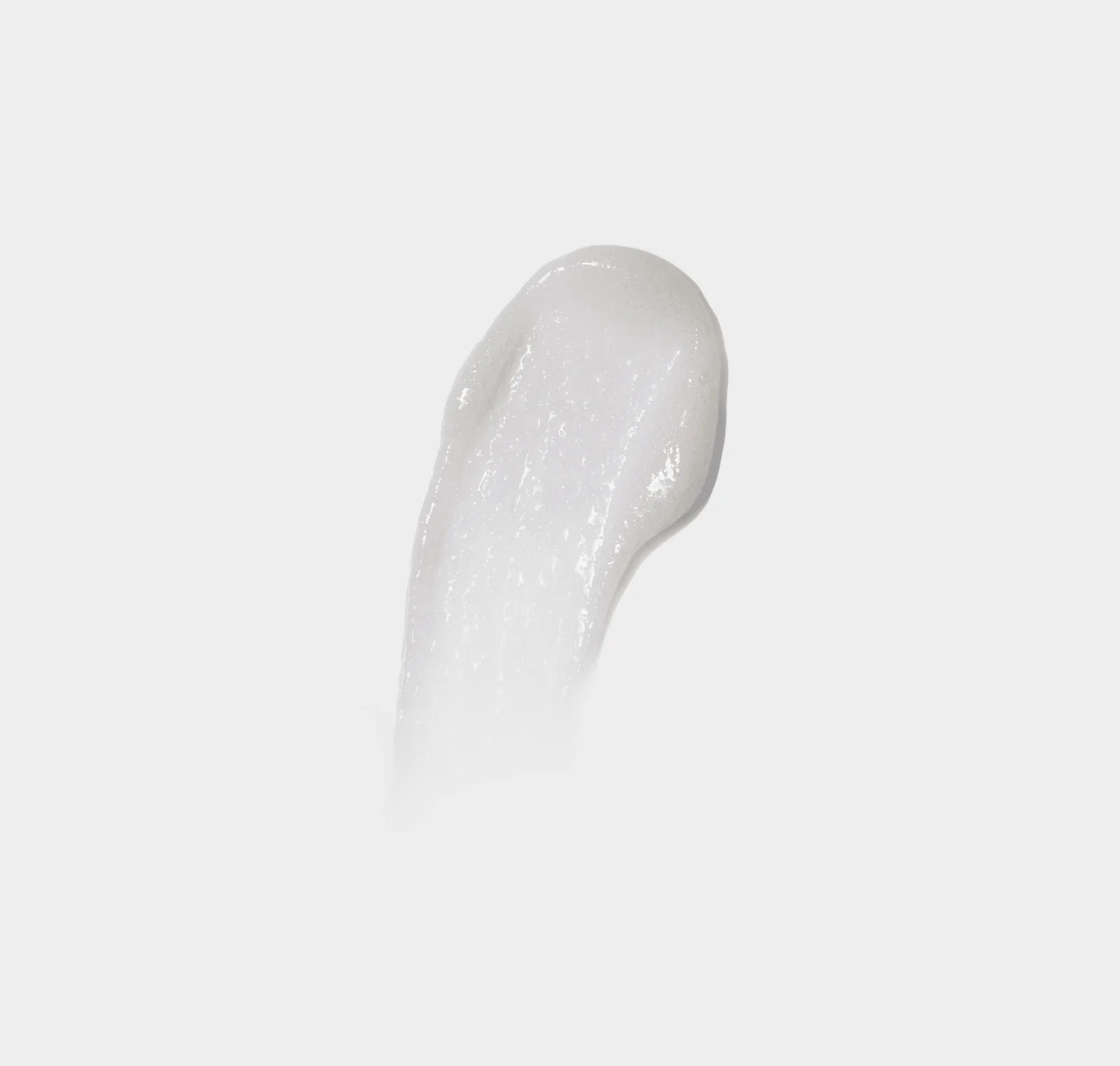 White gel-like substance on a light gray background