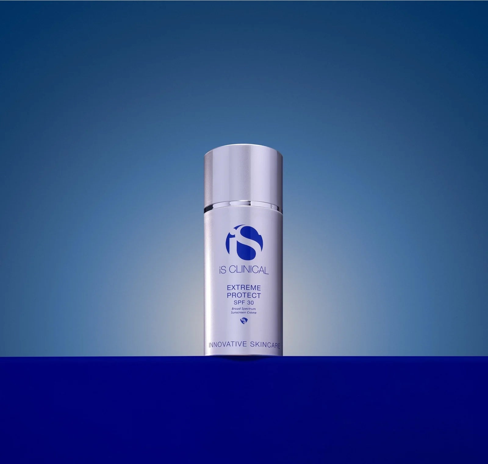 IS Clinical Extreme Protect SPF 50 skincare bottle on a blue gradient background