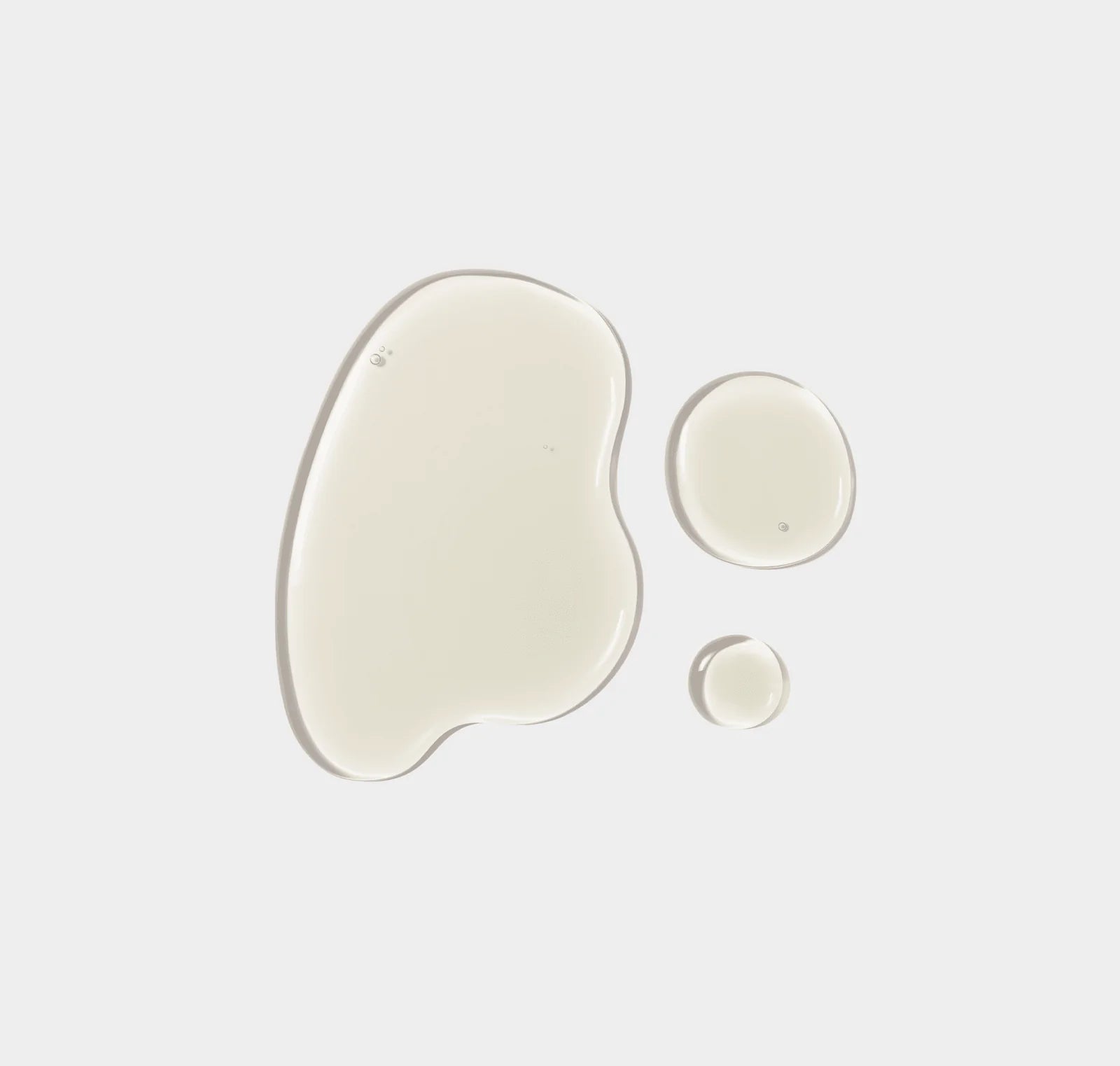 Three different sizes of white gel pads on a light gray background