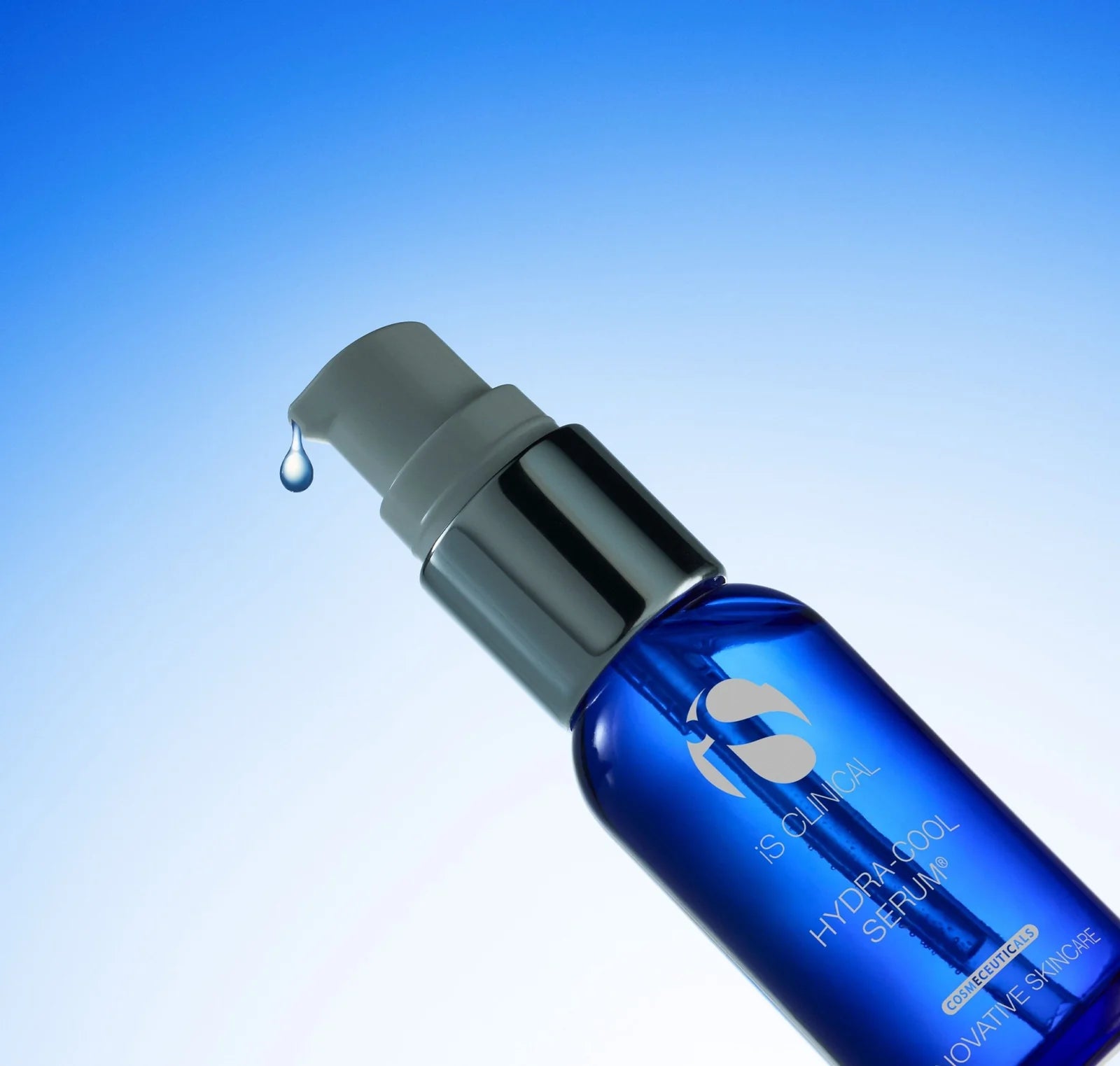 Blue skincare serum bottle with dropper on a gradient blue background