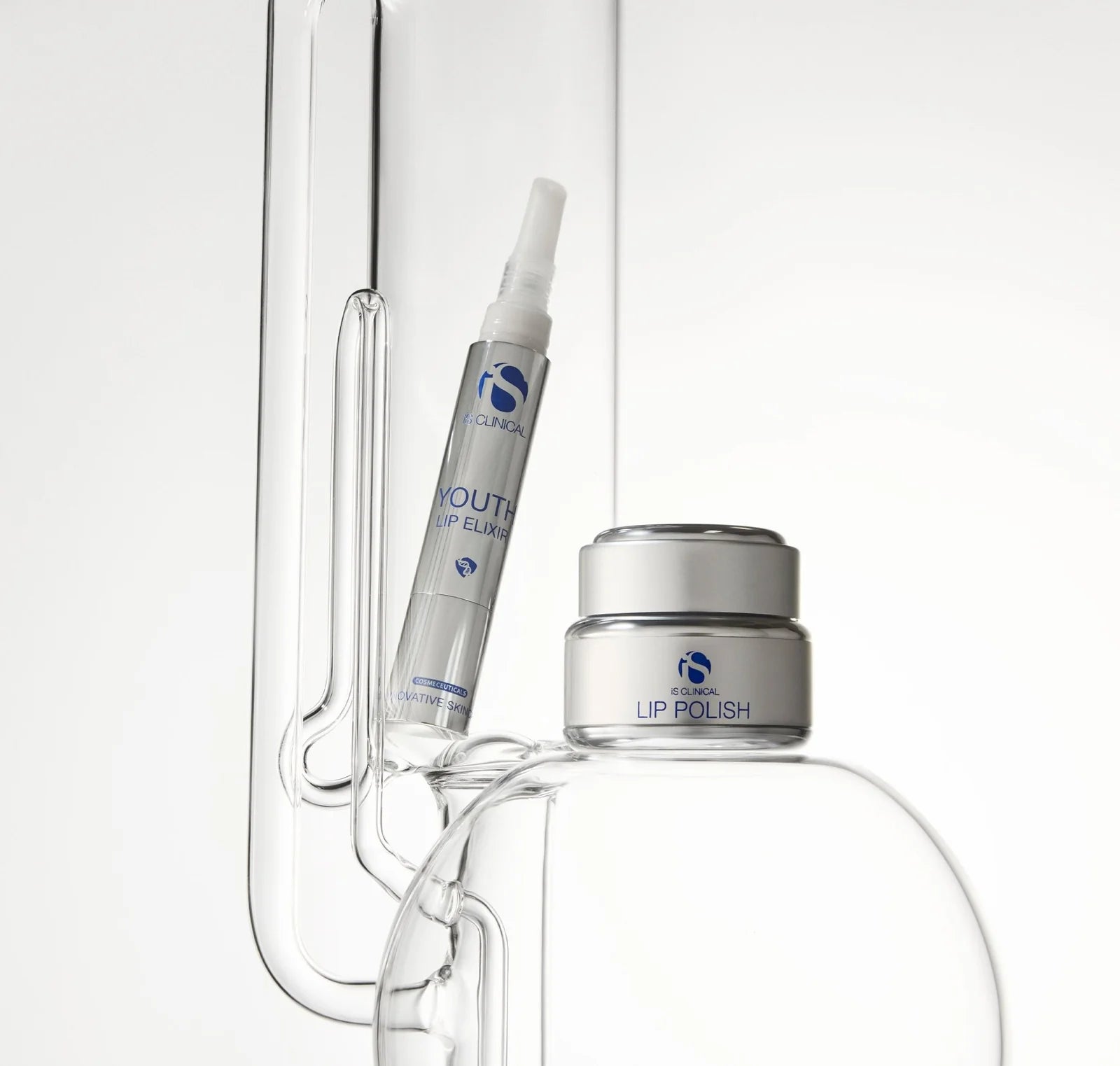 Lip care products including a tube and container on a white background