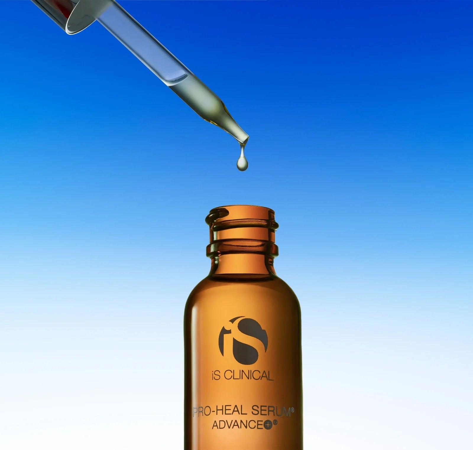 Brown serum bottle with dropper on a blue gradient background