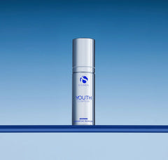 Skincare bottle labeled 'Youth Complex' on a blue gradient background